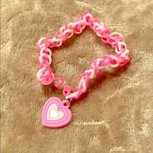 Rubber band bracelet with charm.